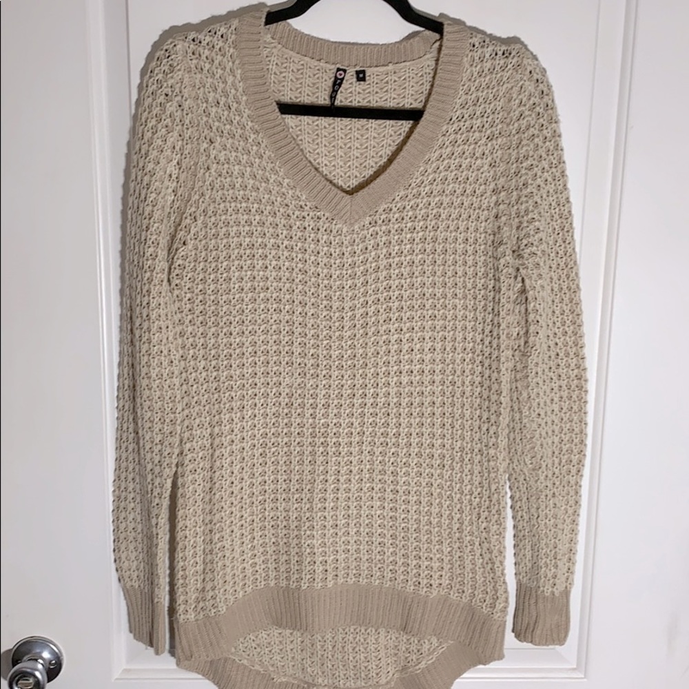 Poof tan and cream sweater. Size M